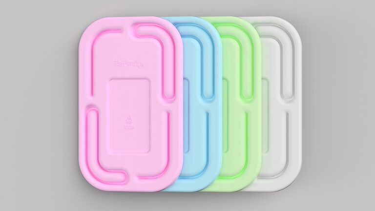 Four RePack Sales Pack moulded paper-pulp trays shown in pink, blue, green and white